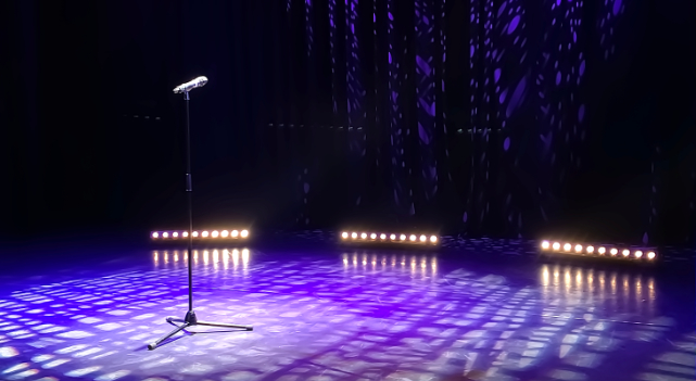 Dynamic shot of performers rehearsing or on stage